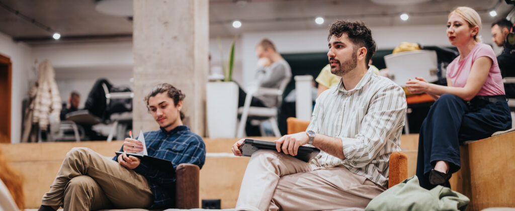 Casual business meeting with people discussing ideas in a modern office